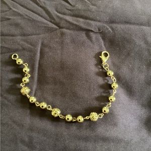 8 inch gold bracelet with safety clasp.